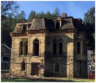 Before: overall view of neglected front façade prior to construction
